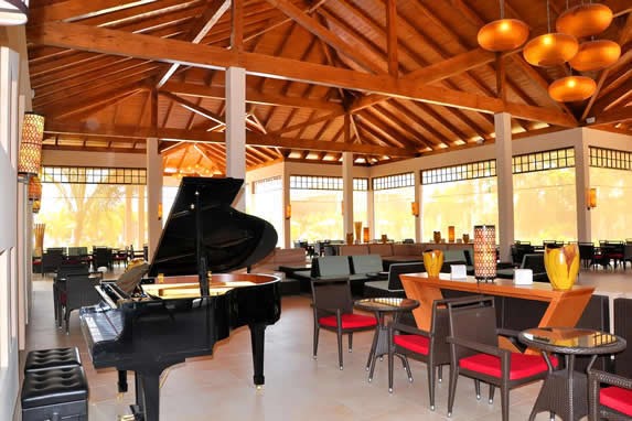 wooden-roofed lobby with grand piano 